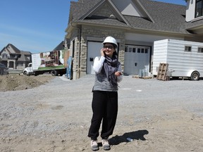 Maryam Mohammad Amin, 28, of Great Gulf Homes is helping to blaze a trail for women in construction after 
graduating from the RESCON Residential Construction Management Certificate Program at George Brown College. Here, she is shown at the construction site for King Oak in King City.