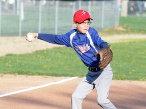 Blake Redfern, at the hot corner, winds up to try and throw out a runner at first at the Major Rookie Tier 2 baseball game against Exeter. ANDY BADER/MITCHELL ADVOCATE