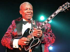 A July 6, 1998 file photo shows US blues legend BB King picks his guitar "Lucille" during a music festival at La Villette park in northeastern Paris. Blues legend B.B. King, known for his soaring guitar licks and as an inspiration for generations of musicians over a decades-long career, has died at the age of 89, his daughter told CNN early on May 15, 2015.