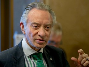Postmedia Network president and CEO Paul Godfrey speaks with employees inside the Calgary Sun office in Calgary, Alta., on Tuesday, April 21, 2015. (Lyle Aspinall/Postmedia Network)