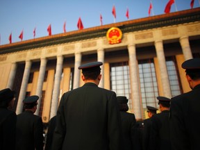 Military delegates arrive for the opening of the annual full session of the National People's Congress, the country's parliament, at Tiananmen Square in Beijing March 5, 2015. China will increase military spending by 10.1 percent this year to 886.9 billion yuan ($141.45 billion), the government announced on Thursday, building on a nearly unbroken two-decade run of annual double-digit rises in the defence budget. REUTERS/Carlos Barria