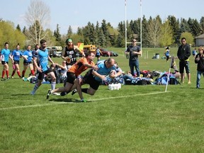 The Parkland Sharks used this second-half try from Graeme Dawes, and three more, to complete a sensational comeback over Lloydminster on May 9. The Sharks won 24-22 after trailing 15-0 at halftime. - Photo courtesy of Parkland Sharks