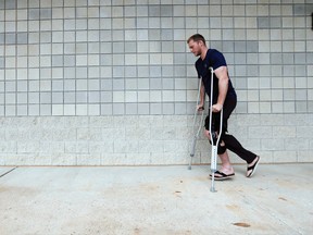 Blue Jays’ Michael Saunders, shown leaving the team’s spring training facility, will be out up to six more weeks. (STAN BEHAL/TORONTO SUN)