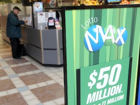A customer buys a lottery ticket at the kiosk at the Garden City mall in Winnipeg, Man. Wednesday Dec. 18, 2013. The Lotto Max jackpot is $50 million this week. Brian Donogh/Postmedia Network