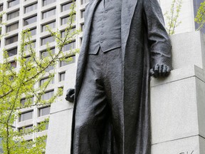 The statue of Adam Beck, the father of Ontario Hydro, on University Ave. in Toronto on May 15, 2015. (Michael Peake/Toronto Sun)