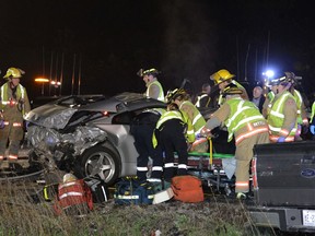 Emergency crews at the scene of a collision on Hwy. 403 around 3:30 a.m. on May 16, 2015. (Andrew Collins/Special to the Toronto Sun)