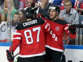 Canada's Taylor Hall (R) celebrates with his teammate Sidney Crosby after scoring a goal against the Czech Republic during their Ice Hockey World Championship semifinal game at the O2 arena in Prague, Czech Republic May 16, 2015. REUTERS/David W Cerny