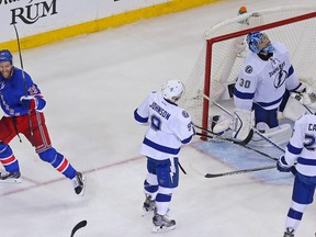 Rangers centre Dominic Moore (left) celebrates after scoring the game-winning goal against Lightning goalie Ben Bishop (30) during the third period in Game 1 of the NHL's Eastern Conference Final in New York on Saturday, May 16, 2015. (Adam Hunger/USA TODAY Sports)