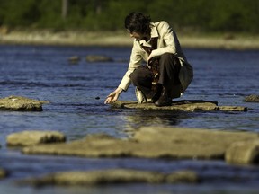 Ottawa Riverkeeper Executive Director, Meredith Brown, checks out the low water levels on the Ottawa River in May 2010. 
Ottawa Sun file pic