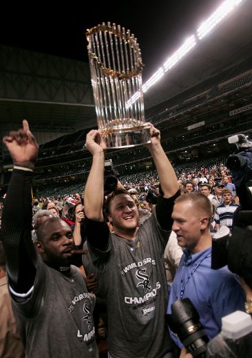 Chicago's Mark Buehrle celebrates with catcher Chris Widger after