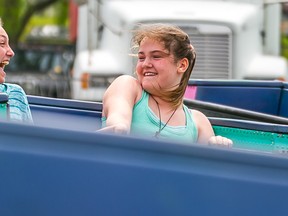 Intelligencer file photo
Mercy Faulkner (left) and Sam Lloyd of Trenton take a turn on one of the many rides at Riverfest in Frankford last year. The annual event suffered some setbacks Thursday night when two rides experienced malfunctions Thursday night.