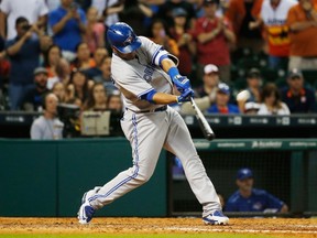 Blue Jays' Edwin Encarnacion hits a two-run home run against the Astros on Saturday night in Houston. (GETTY IMAGES)