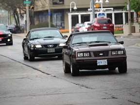 Ford Mustang owners parade their cars up Front Street in Sarnia Saturday, as they participate in the third annual Mustang Sally Rally Poker Run. Organizers said about 100 cars were part of this year's event that helps raise money for Pathways Health Centre for Children. Tyler Kula/Sarnia Observer/Postmedia Network