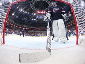 Goalkeeper Connor Hellebuyck of USA pulls the puck out of the net after a goal by forward Vadim Shipachyov of Russia during the semi final match USA vs Russia at the 2015 IIHF Ice Hockey World Championships on May 16, 2015 at the O2 Arena in Prague. AFP PHOTO / POOL / ANDRE RINGUETTE