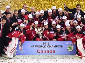Players of team Canada pose with the trophy of the IIHF Ice Hockey World Championship after winning the IIHF Ice Hockey World Championship final match Canada vs Russia on May 17, 2015 at the O2 Arena in Prague. Olympic champions Canada won the ice hockey world championship after sweeping defending champions Russia 6-1 in the final.  AFP PHOTO / JONATHAN NACKSTRAND