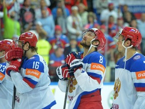 Russia's Alexander Ovechkin (2nd R) reacts after the gold medal match Canada vs Russia at the 2015 IIHF Ice Hockey World Championships on May 17, 2015 at the O2 Arena in Prague. (AFP PHOTO / MICHAL CIZEK)