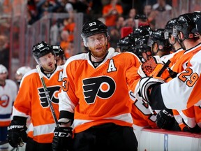 Jakub Voracek #93 of the Philadelphia Flyers celebrates his assist with teammates on the bench after Claude Giroux scored in the first period against the New York Islanders on April 7, 2015 at the Wells Fargo Center in Philadelphia, Pennsylvania.  (Elsa/Getty Images/AFP)
