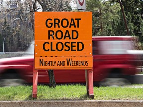 A sign notifying drivers of a nightly road closure of Groat Road is seen near 105 Street and River Valley Road in Edmonton. Four of the seven girders for the 102 Avenue bridge must be taken down and inspected, according to the city. Codie McLachlan/Edmonton Sun/Postmedia Network