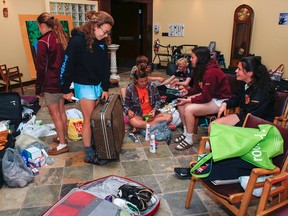 The chapel is a flurry of last-minute packing as a group of students at Regiopolis-Notre Dame Catholic High School in Kingston makes final adjustments to their luggage on Thursday. The group of 17 students will be spending eight days in Kingston, Jamaica, as part of an annual mission. (Julia McKay/The Whig-Standard)
