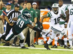 Michael Cambell #16 of the New York Jets runs after a catch and chased by Adrian robinson #49 of the Philadelphia Eagles during their preseason game at MetLife Stadium on August 29, 2013 in East Rutherford, New Jersey. (Al Bello/Getty Images/AFP)