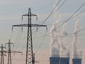 Electrical power pylons of high-tension electricity power lines are seen near cooling towers.

REUTERS/Christian Hartmann/Files