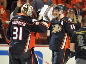 Anaheim Ducks right wing Corey Perry (10) and goalie Frederik Andersen (31) celebrate the 4-1 victory against the Chicago Blackhawks following the third period in game one of the Western Conference Final of the 2015 Stanley Cup Playoffs at Honda Center. (Gary A. Vasquez-USA TODAY Sports)