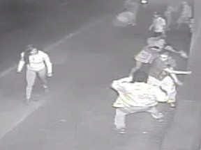 Surveillance video shows a male and female converging on victim Jesse Scott James.