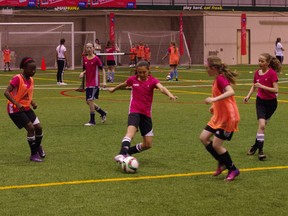 Katya Cisneros, 11, goes for a goal at the FIFA's Live Your Goals Festival. (RYAN SIMON/Winnipeg Sun)