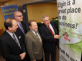 John Regan, left, general manager of the Elgin Business Resource Centre in St. Thomas, Alan Smith, general manager of economic development for Elgin County, Aylmer Mayor Jack Couckuyt and Elgin County Warden Bill Walters look over the county's location on this promotional banner on display at the new EBRC satellite office officially opened Friday March 2, 2012 in the Elgin Innovation Centre (formerly Imperial Tobacco offices on John Street) in Aylmer, Ontario in partnership with the county.