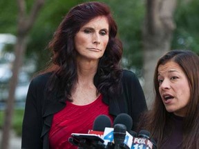 Cindy Lee Garcia (L), an actress in the "Innocence of Muslims", and her lawyer M. Cris Armenta hold a news conference after a court hearing in Los Angeles, California September 20, 2012. (REUTERS/Bret Hartman)