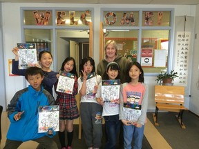 Chinese exchange students pose for a photo with their paint on t-shirts. Photos submitted.