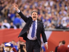 Kentucky Wildcats head coach John Calipari gestures against the Wisconsin Badgers in the first half of the 2015 NCAA Men's Division I Championship semifinal game at Lucas Oil Stadium on April 4, 2015. (Bob Donnan/USA TODAY Sports)
