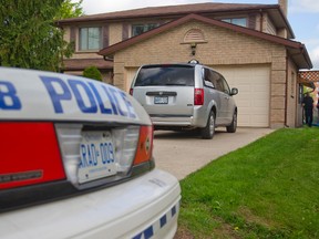 Police on scene at 26 Applegreen Grove where a five-year-old girl was stabbed by a man known to the girl early Tuesday morning in London, Ont. on Tuesday May 19, 2015. 
The girl was stabbed several times and is in hospital with life threatening injuries. (Mike Hensen, The London Free Press)