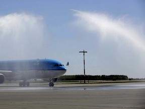 Water is sprayed over KLM Royal Dutch Airlines’ first non-stop flight between Amsterdam Schiphol Airport after landing at the Edmonton International Airport (EIA).Photo Supplled/EIA