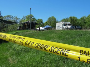 OPP and Kingston Police investigators search property along North Shore Road in South Frontenac Township on Tuesday for evidence believed to be linked to the disappearance of Gordon Cameron in 1993. (Anisa Rawhani/For The Whig-Standard)