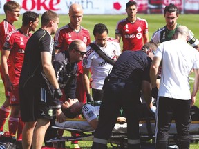 Portland Timbers midfielder Will Johnson is carried off the field on a stretcher after breaking his leg against Toronto FC last year. (VERONICA HENRI/Toronto Sun)