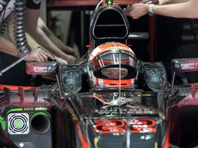 McLaren Honda driver Jenson Button sits in the pits during a Spanish Grand Prix practice session at the Circuit de Catalunya on May 8, 2015 in Montmelo. (AFP PHOTO/TOM GANDOLFINI)