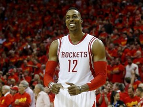 Dwight Howard #12 of the Houston Rockets celebrates after they defeated the Los Angeles Clippers 113 to 100 during Game Seven of the Western Conference Semifinals at the Toyota Center for the 2015 NBA Playoffs on May 17, 2015 in Houston, Texas. (Scott Halleran/Getty Images/AFP)