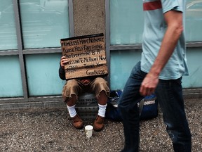 NEW YORK, NY - MAY 18: A homeless man panhandles along Eighth Avenue in Manhattan on May 18, 2015 in New York City. As many parts of once seedy New York City have been transformed into family and shopping friendly environments, 8th Avenue near the Port Authority bus station is one of the last hold-outs to old gritty Manhattan. Last week a man was shot by police after he attacked numerous people with a hammer along a stretch of the street. There is a high police presence along the street and fights and arrests for vagrancy are common.   Spencer Platt/Getty Images/AFP== FOR NEWSPAPERS, INTERNET, TELCOS & TELEVISION USE ONLY ==