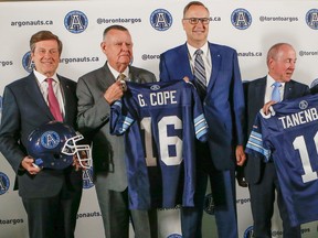 From left, Mayor John John Tory, David Braley, George Cope, Larry Tanenbaum and Jeffrey Orridge at the announcement of the Argos sale in Toronto on Wednesday, May 20, 2015. (Dave Thomas/Toronto Sun)