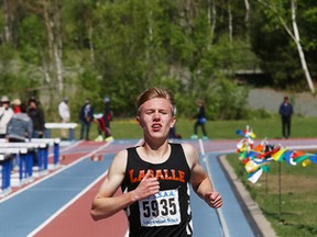 Liam Passi, of Lasalle secondary School, competes in the senior boys 3,000 metre race at the local high school track and field championships at Laurentian University track in Sudbury, Ont. on Wednesday May 20, 2015. Passi won the race.