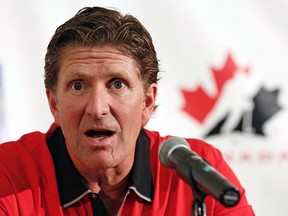 Mike Babcock answers questions during a Hockey Canada news conference in Calgary, Alberta, in this file photo taken August 25, 2013. (REUTERS/Todd Korol/Files)