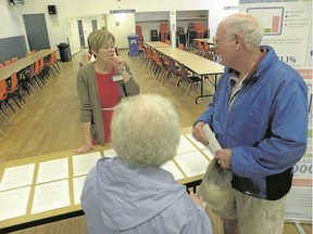 Ernst Kuglin/The Intelligencer
Cynthia Martineau, director of health system design with the LHIN, talks to residents at the latest health care open house held in Trenton Wednesday. Martineau said response to an online survey on the future of health care service delivery has been good.