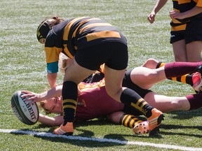 The Regiopolis-Notre Dame Panthers were stopped on the try line by the La Salle Black Knights on this drive, but the Panthers prevailed in the Kingston Area Secondary Schools Athletic Association girls rugby final, 20-15, at Nixon Field on Wednesday. (Tim Gordanier/The Whig-Standard)