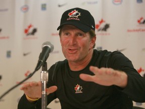 Mike Babcock speaks to media at the orientation camp for the men's 2010 Olympic hockey team held at the Pengrowth Saddledome in Calgary Aug 24, 2009. (Jim Wells/Postmedia Network)