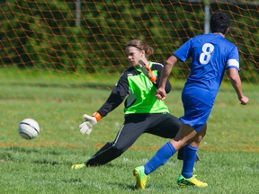 Strathroy keeper Jimmy Knapman is left alone and Oaks forward Achille Laskares makes no mistake to make the score 2-0 during their TVRA Central boys soccer quarterfinal at Oakridge on Wednesday. (MIKE HENSEN, The London Free Press)