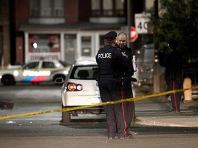 Toronto Police at the scene of a fatal shooting late Wednesday, May 20, 2015 on Campbell Ave., in the Bloor St. W. and Lansdowne Ave. area. (John Hanley/Special to the Toronto Sun)