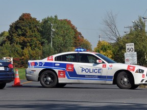Two young women have been charged after an alleged suicide plan backfired resulting in a car crash on Oct. 8, 2014 in Montreal. Mathieu Lacombe/Postmedia Network
