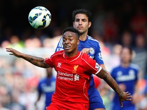 Chelsea's Cesc Fabregas in action with Liverpool's Raheem Sterling (front) during Premier League play. (Reuters file photo)