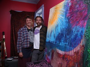 Gino Donato/Sudbury Star
Liz O'Hara and Arjan Namdev show off a painting that will be auctioned off at the official launch party for the Psychic Vibrations Creative Collective this weekend.